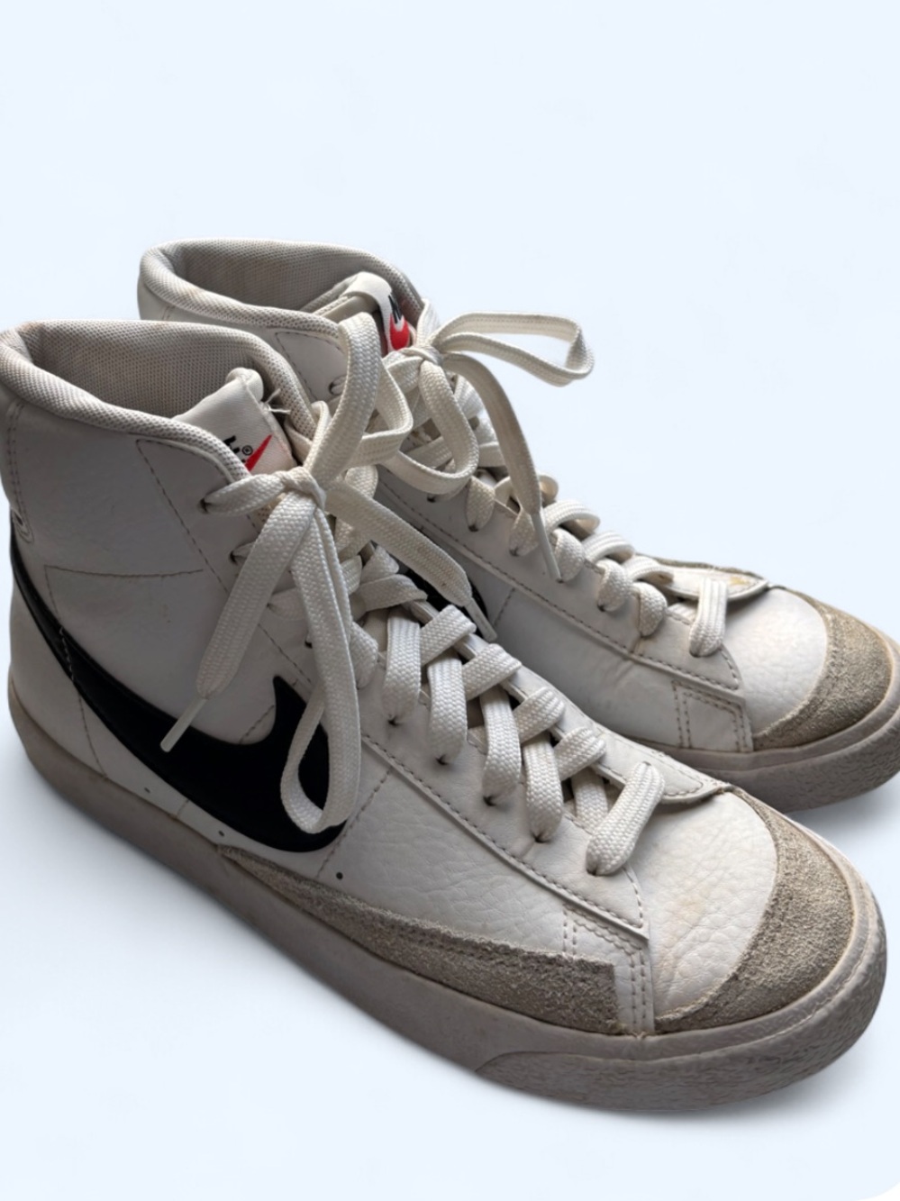 Nike High-Top Sneakers in White with Black Swoosh